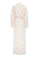 Floral, feminine dress featuring button closure and loose fit.