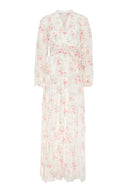 Floral, feminine dress featuring button closure and loose fit.
