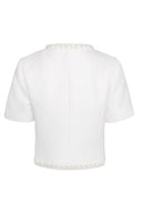 Feminine, tweed blouse featuring braided trim and slightly cropped fit.