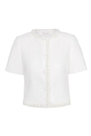 Feminine, tweed blouse featuring braided trim and slightly cropped fit.
