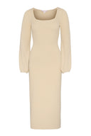Knitted midi dress featuring fitted silhouette and logn sleeves.